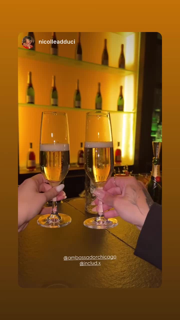 Champagne glasses raised in a toast