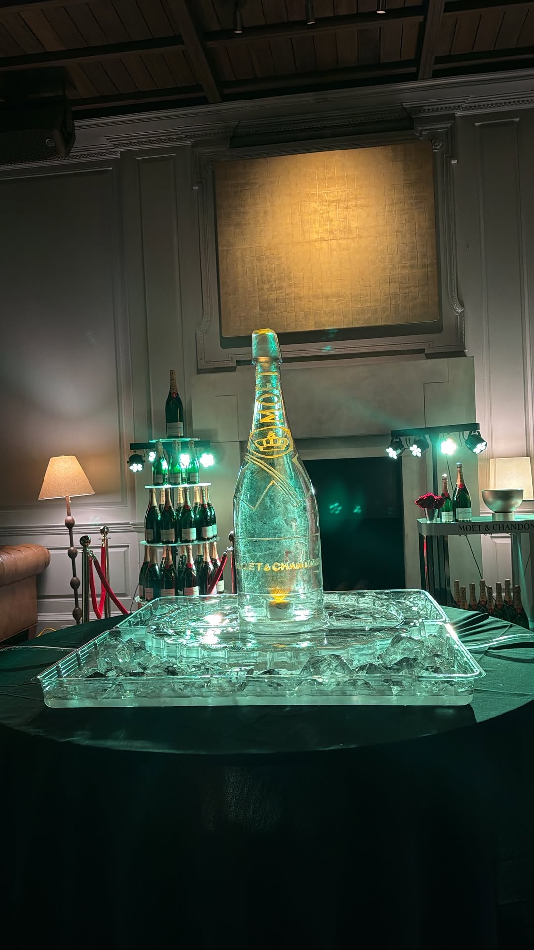Illuminated Moët & Chandon bottle set in an ice sculpture inside the venue