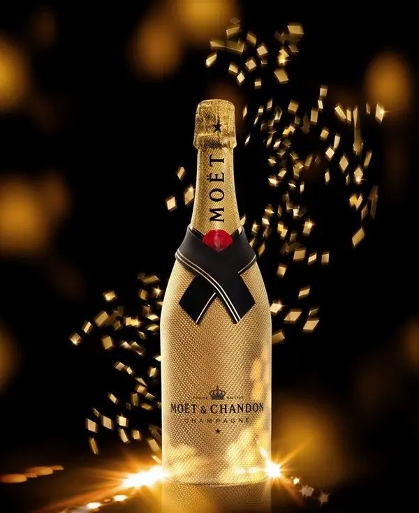 Illuminated Moët & Chandon bottle surrounded by gold confetti